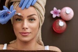 Beauty woman giving botox injections. botox, cosmetic treatments, wrinkle removal, Botox injections